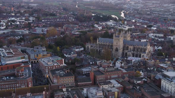 Evening aerial of a busy exeter city centre. A market taking place on ...