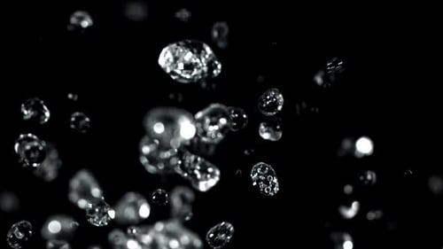 Water Droplets Rise and Fall on a Black Background Filmed on a Highspeed Camera at 1000 Fps