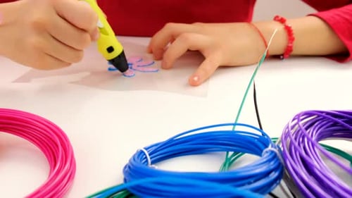 Child Drawing Flower With 3D Printing Pen