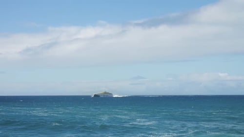 Slowotion footage of a ferry boat on the atlantic ocean driving through canarian islands with the vu