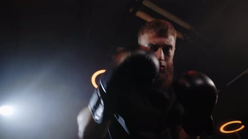 POV Male Shot of Boxer Strikes Into the Side of the Camcorder