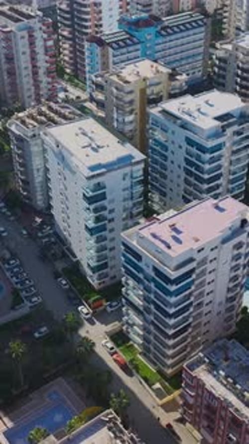 Vertical Video of Rooftops in a Mountain Village Captured From Above Featuring Wooden Houses and