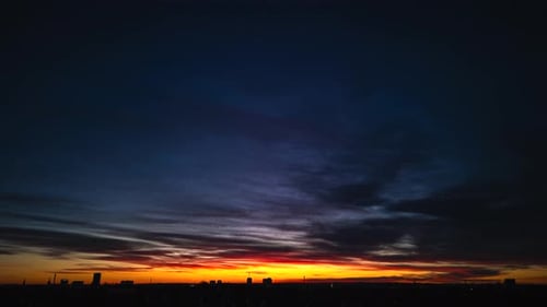 Sunset Over Cityscape, Colorful Clouds and Skyline