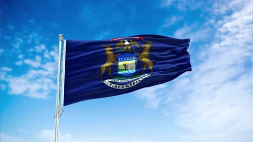 Michigan State Flag Waving Against Blue Sky Loop