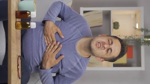 Vertical video of Man with chest pain.