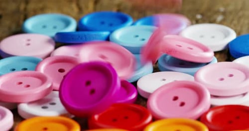 fall in slow motion buttons colorful couture, buttons of all high-fashion colors to sew on clothin