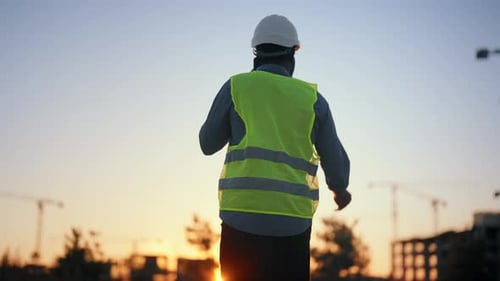 Construction and Development Architect or Engineer Talking By Phone Back View Professional and