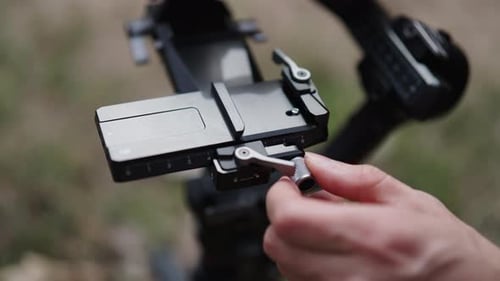 Hand Adjusting Lever on Camera Gimbal Stabilizer