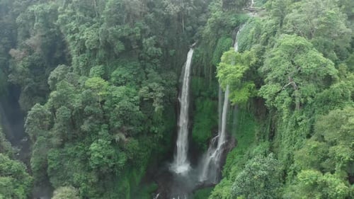 Tropical Waterfall Cascade Through Lush Green Jungle