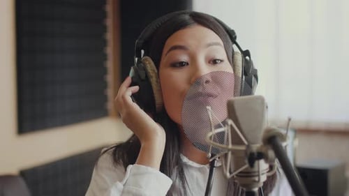 Singer Performs in Professional Music Studio with Highquality Equipment