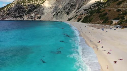 Aerial drone video of iconic turquoise and sapphire bay and beach of Myrtos, Kefalonia (Cephalonia)