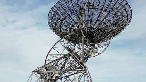 Aerial close-up shot of the modern radiotelescope antenna at the Mullard Radio Astronomy Observatory