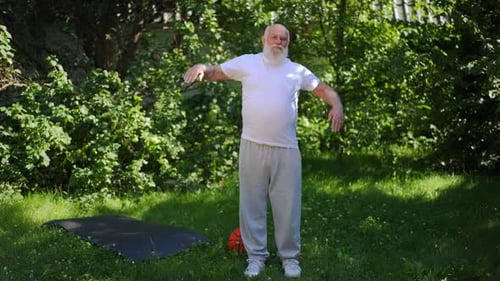 Senior Man Stretching Outside on a Sunny Day