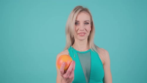 Woman Holding Grapefruit for Healthy Diet