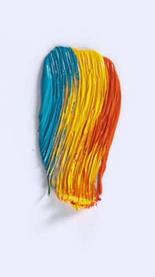 Glossy teal yellow orange paint stroke