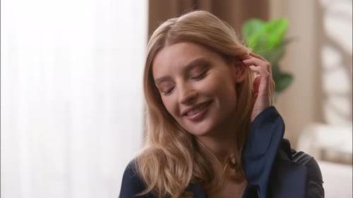 Smiling Woman with Blond Hair Indoors