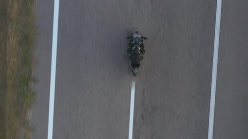 Top View to Biker Riding on Modern Sport Motorbike at Highway