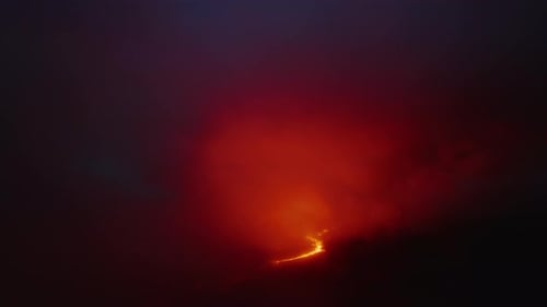 Aerial Above Glowing at Night Magma and Orange Cloud Above Mauna Loa Mountain