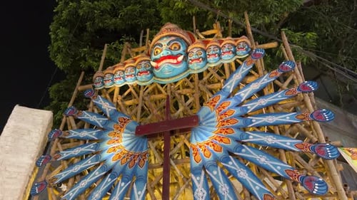 Blue Religious Statue on Scaffolding at Night