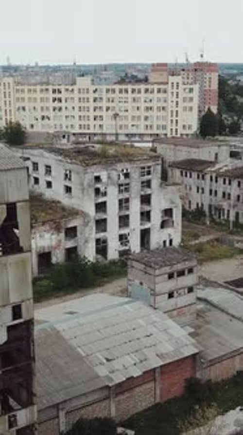 Flight over the destroyed factory. Old industrial building for demolition. Aerial view