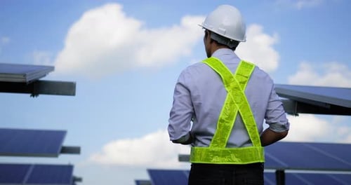 Portrait Asian young inspector engineer man in solar farm