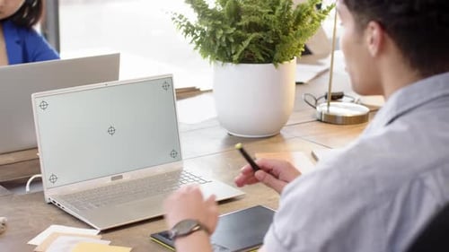 On video call, stylus and laptop, ma, interior design project at desk, copy space, at office