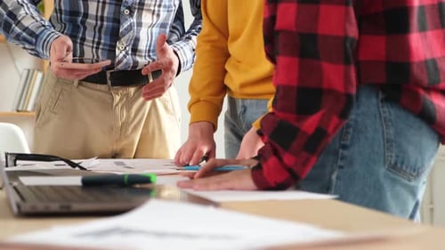Business People Collaborating on Table Indoors