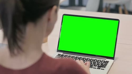 Close up of Beautiful Woman Working on Laptop with Chroma Key Screen
