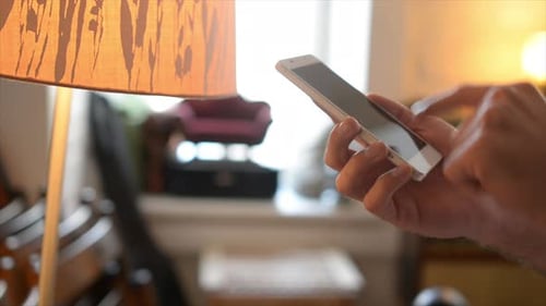 Side View of hand Browsing Phone