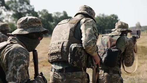 Military Special Forces Unit Attacks the Enemy with Ammunition and Weapons on the Battlefield