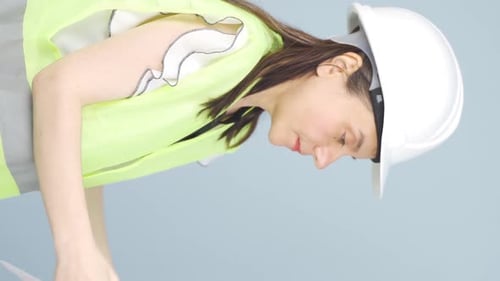 Vertical video of The engineer approves the news she heard.