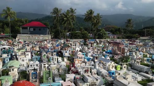 Aerial top-down view of colorful tombs arranged in a tight grid in Dili, Timor-Leste