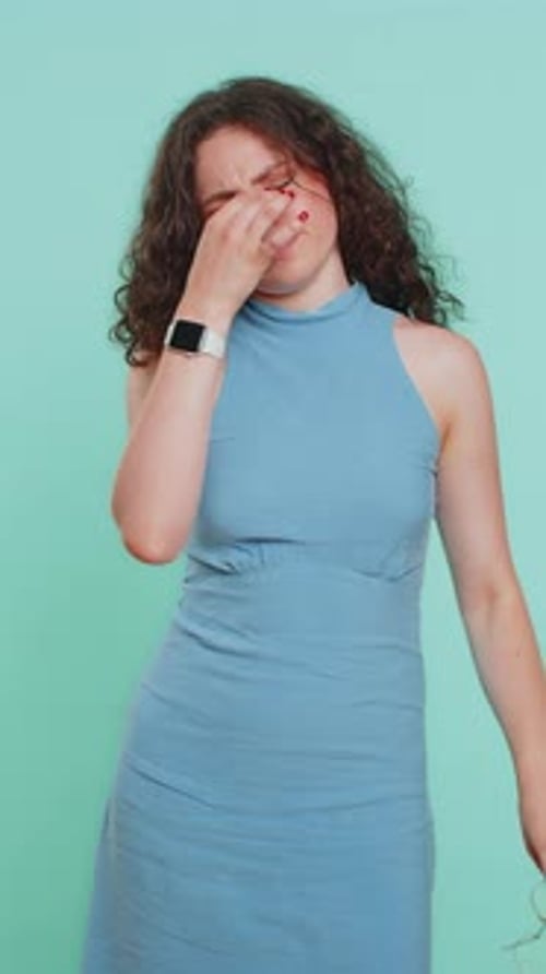 Woman Suffering From Headache Removes and Replaces Glasses