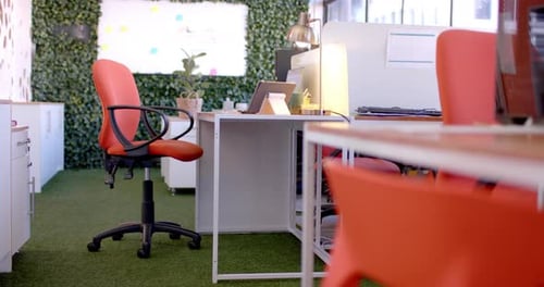 Office interior with green wall and whiteboard, slow motion