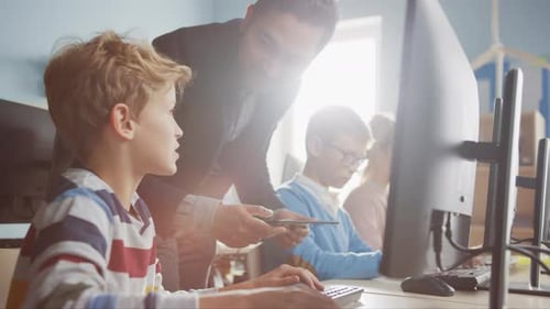 Elementary School Science Classroom: Enthusiastic Teacher Talks with a Smart Schoolboy. Using Perso
