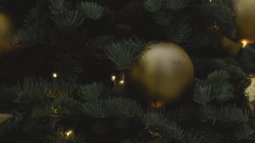 Christmas Tree with Gold Ornaments and Glowing Stars