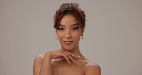 Beauty, woman and face with skincare in studio for natural glowing skin