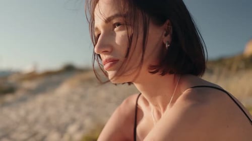 Thoughtful Woman on Beach