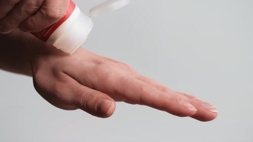 Applying Cream to Hands in Close Up Shot