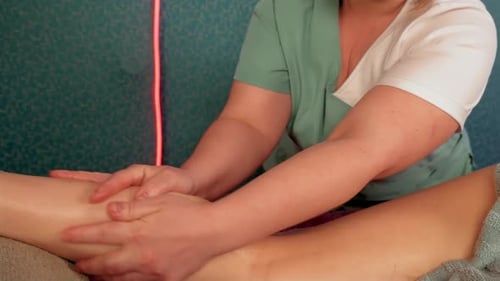 Young Naked Girl Getting Massage for Legs and Buttocks in Spa Salon Close Up Hands of Masseuse Slide