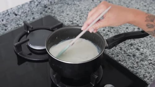 Hand Stirring Custard in a Pot