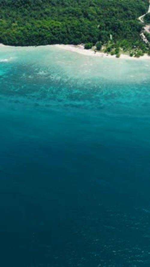 Beach and Ocean Waves on Coastline of Samal Island Davao Philippines