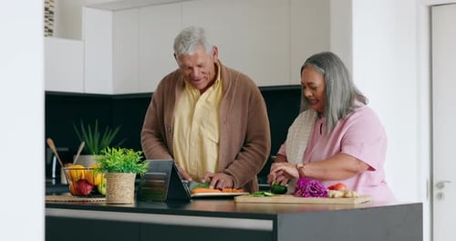 Senior Couple Cooking Together in Kitchen