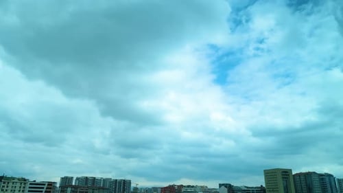 Moving Clouds Over an Urban Setting Time Lapse