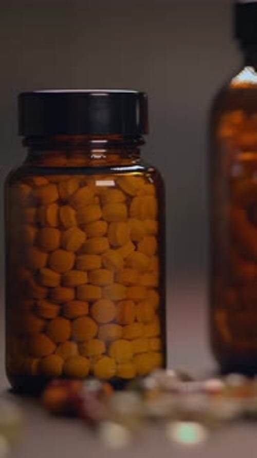 Bottle of Pills Close Up Medical Concept