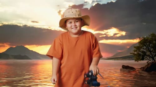 Asian Boy Dancing After Use The Binoculars At A Lake