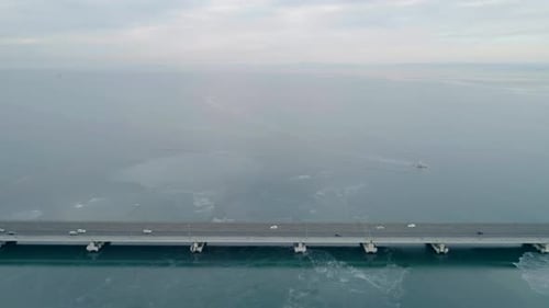Aerial Drone View of Lowwater Bridge Across the Bay with Moving Car Active Movement of Transport