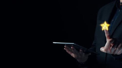 Man Using Tablet for Five Star Rating Feedback