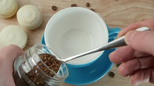 Preparing Instant Coffee with Macarons, Close Up