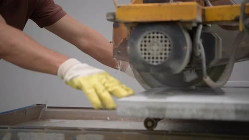 Cutting Concrete Path Tiles Using Powerful Saw